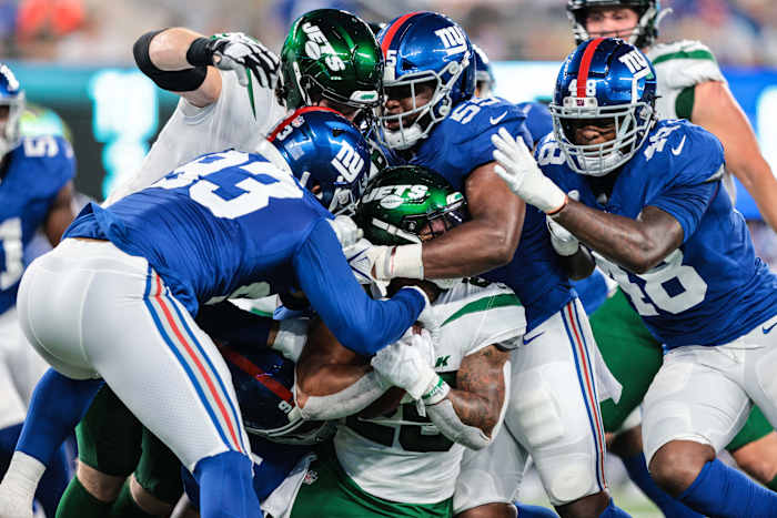 Jets running back Ty Johnson (25) is tackled by New York Giants linebackers Trent Harris (93) and Tae Crowder (48). Mandatory Credit: Vincent Carchietta-USA TODAY